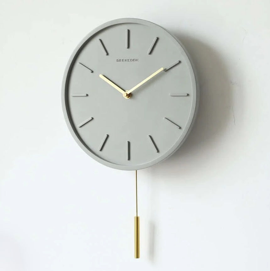 Scandinavian cement wall clock with metal pendulum